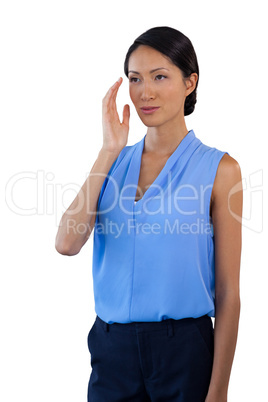 Thoughtful businesswoman looking away while gesturing