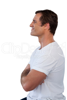 Side view of smiling mature man with arms crossed