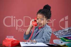 Businesswoman talking on land line