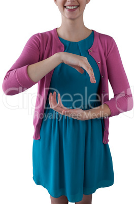 Teenage girl pretending to be hold invisible object