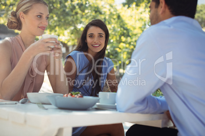 Friends having breakfast at restaurant