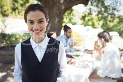 Portrait of smiling waitress