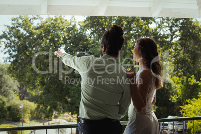 Couple looking at view in restaurant