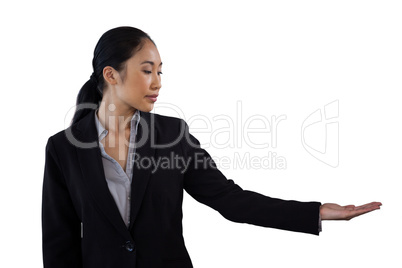 Businesswoman holding invisible product