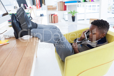 Side view of businessman talking on smartphone