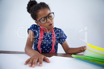 Girl as businesswoman looking at files