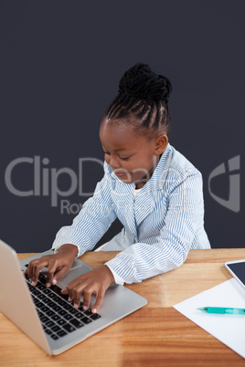 High angle view of businesswoman typing on laptop