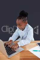 High angle view of businesswoman typing on laptop
