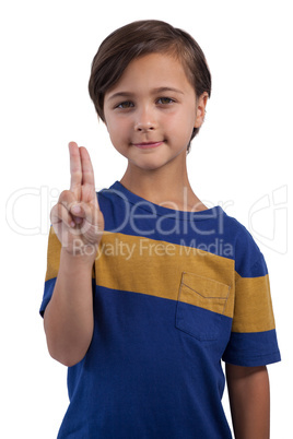 Happy boy posing against white background