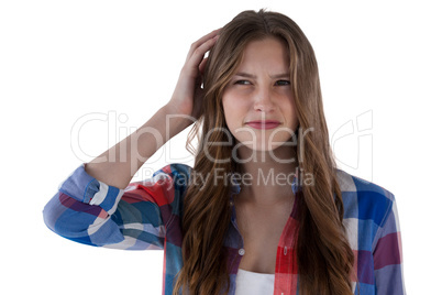 Teenage girl standing against white background
