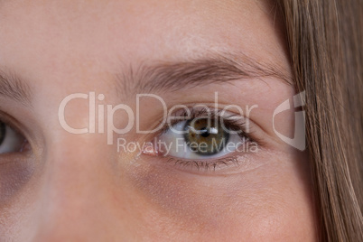 Girls eye and nose against white background