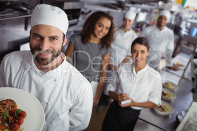 Restaurant manager with his kitchen staff