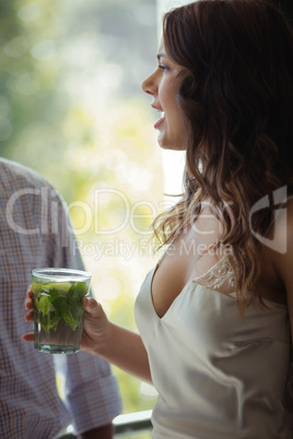 Woman holding a cocktail glass in restaurant