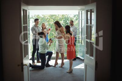 Man proposing woman with engagement ring