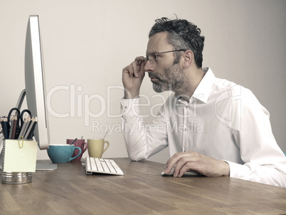 Tired businessman at night office