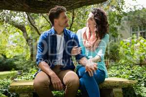 Romantic couple interacting with each other in garden
