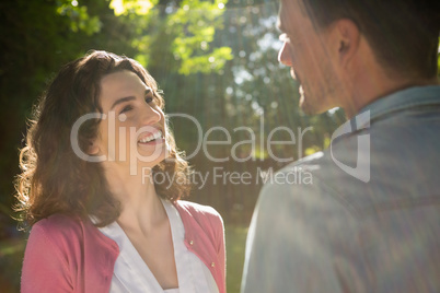 Romantic couple looking face to face in garden