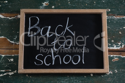 Back to school text written on chalkboard