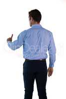 Businessman in blue shirt using invisible interface