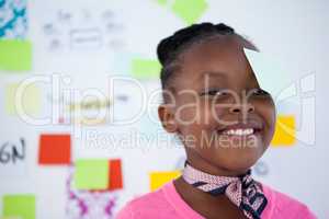 Close-up portrait of businesswoman with sticky notes