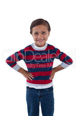 Cute boy standing with hand on hip