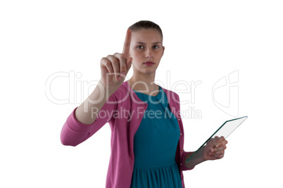 Teenage girl pressing an invisible virtual screen