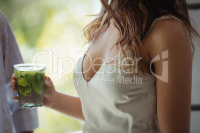 Woman holding a cocktail glass in restaurant