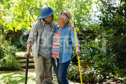 Senior couple standing in garden