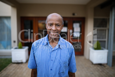 Portrait of smiling senior man at nursing home