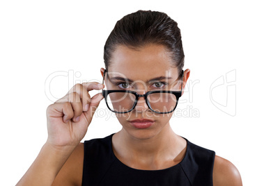 Portrait of young businesswoman holding eyeglasses