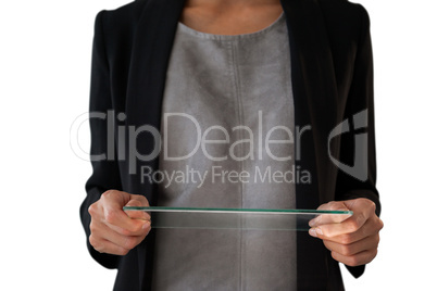 Mid section of businesswoman holding glass interface