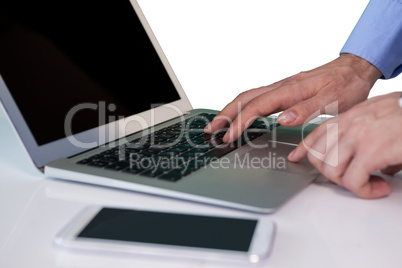 Cropped image of businessman using laptop computer