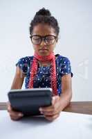 Girl pretending as businesswoman using calculator