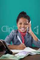 Smiling businesswoman talking on mobile phone