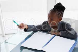 High angle view of businesswoman with document at table