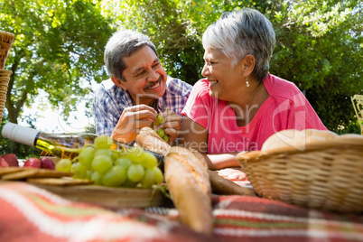 Senior couple smiling while looking at each other