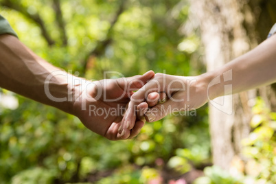 Hand of couple holding hands