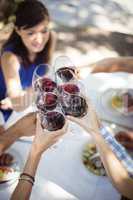 Group of friends toasting champagne glasses in a restaurant