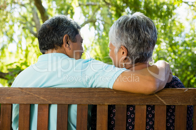 Senior couple sitting in garden on a sunny day