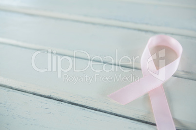 Close-up of pink Breast Cancer Awareness ribbon on table