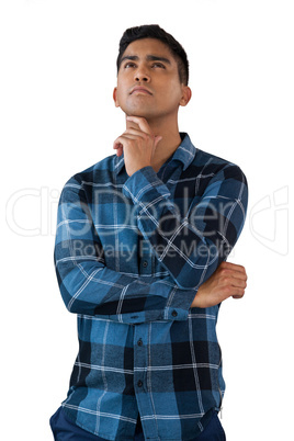 Thoughtful young man with hand on chin