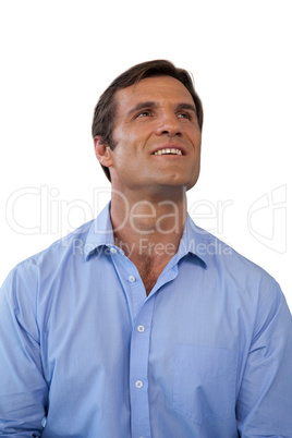 Thoughtful mature businessman looking up