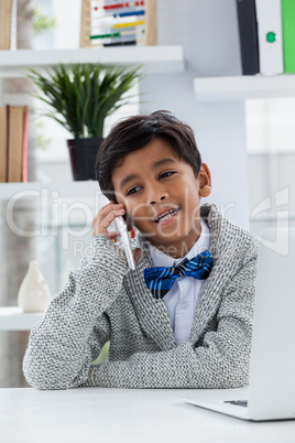 Smiling businessman talking on phone