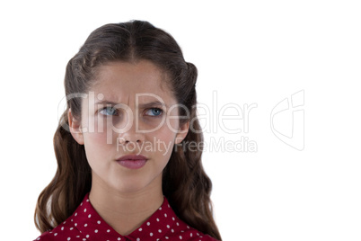 Teenage girl standing against white background