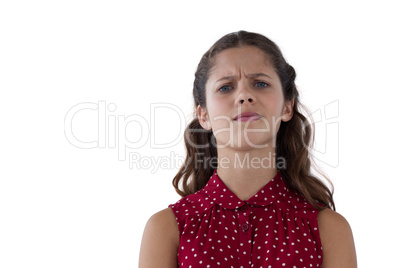 Teenage girl standing against white background