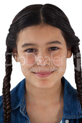 Smiling cute girl standing against white background