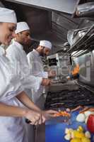 Chefs chopping vegetables