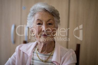 Portrait of senior woman sitting on chair