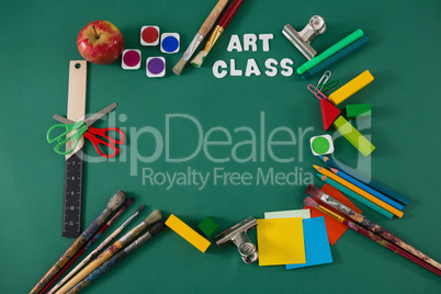 School supplies with text arranged on green background