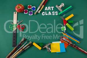 School supplies with text arranged on green background